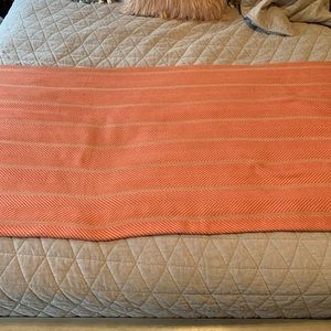 King sized reddish/orange throw blanket
